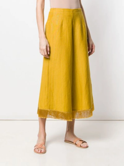 Shop Forte Forte Fringe Hem Flared Trousers In Yellow