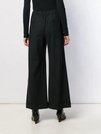 Shop Brunello Cucinelli Flared Trousers - Black
