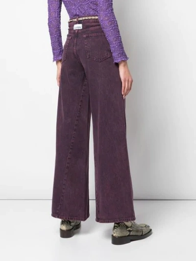 Shop Ganni Flared Belted Jeans In Purple