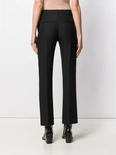 Shop Valentino Flare Leg Trousers In Black