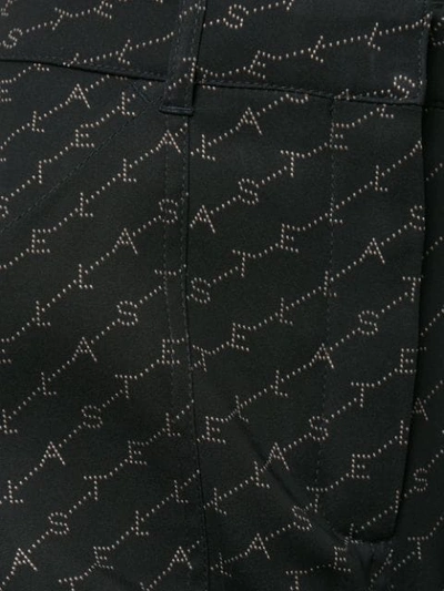 Shop Stella Mccartney Tina Monogram Trousers In Black