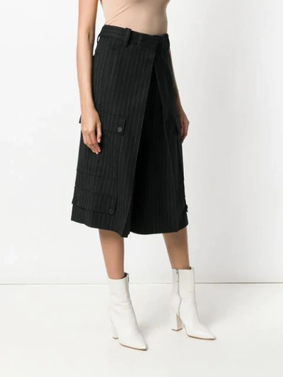 Shop Jw Anderson Cropped Pinstripe Trousers In Black