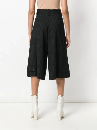 Shop Jw Anderson Cropped Pinstripe Trousers In Black