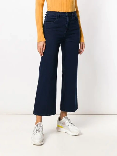 Shop J Brand Cropped Flared Jeans In Blue