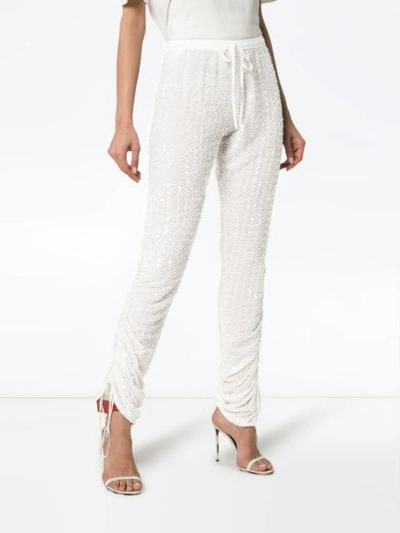 Shop Ashish Sequin Embellished Track Pants In White