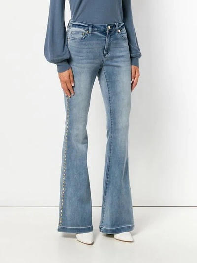 Shop Michael Michael Kors Studded Flared Jeans In Blue