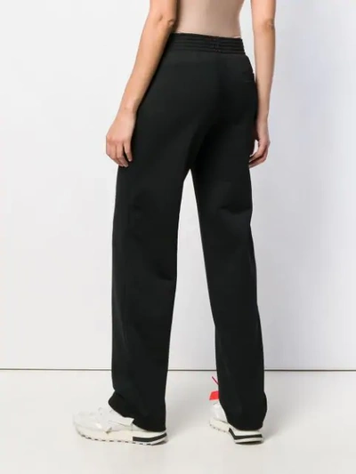 Shop Givenchy High Waisted Logo Trousers In Black