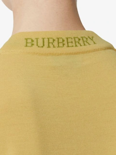 Shop Burberry Logo Detail Merino Wool Sweater In Yellow