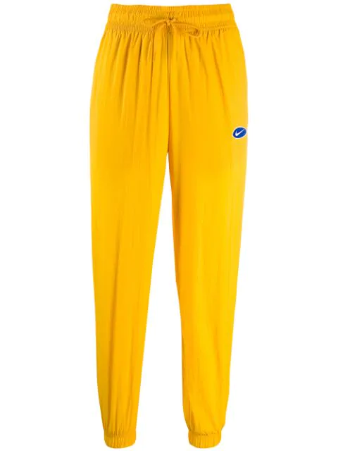 nike track pants yellow
