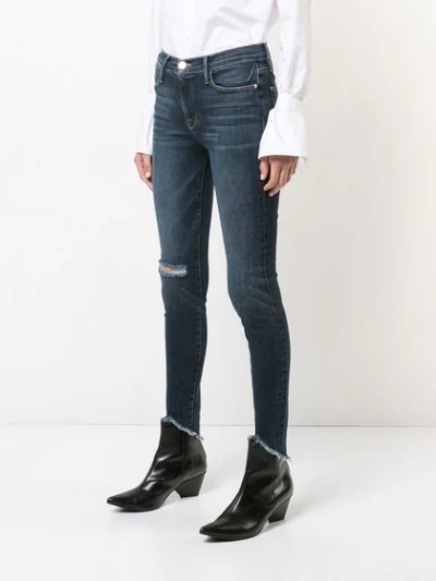 Shop Frame Distressed Effect Skinny Jeans In Blue