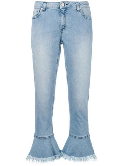 Shop Michael Michael Kors Fringed Hem Jeans In Blue