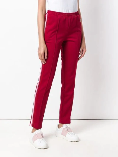 Shop Moncler Slim Side Stripe Joggers In Red