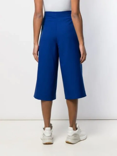 Shop Etudes Studio Alto Cropped Trousers In Blue