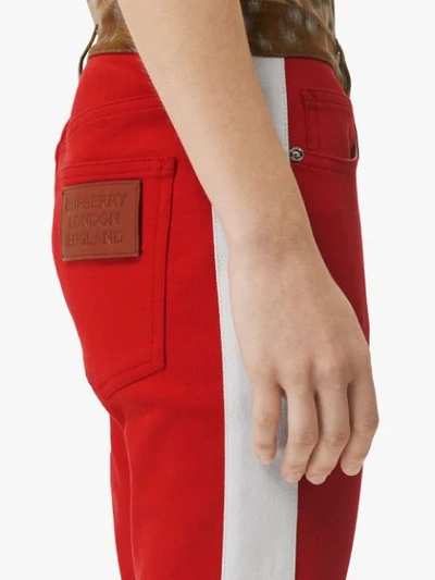 Shop Burberry Straight Fit Deer Print Trim Japanese Denim Jeans In Red