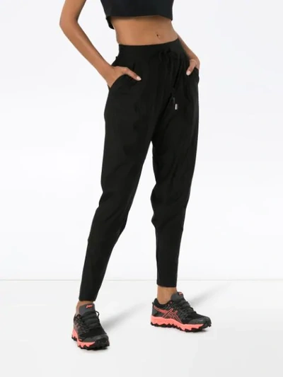 Shop Charli Cohen Saber Matte Tapered Trousers In Black