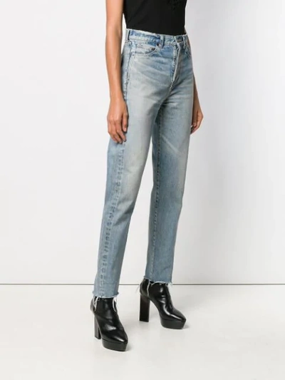 Shop Saint Laurent Slim-fit Raw Edge Jeans In Blue