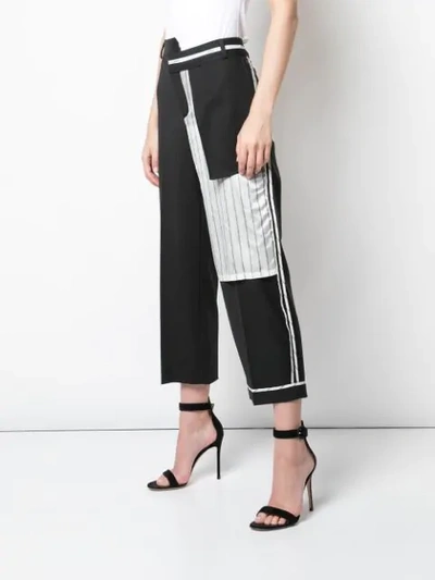 Shop Monse Inside Out Pinstripe Pocket Trousers In Black