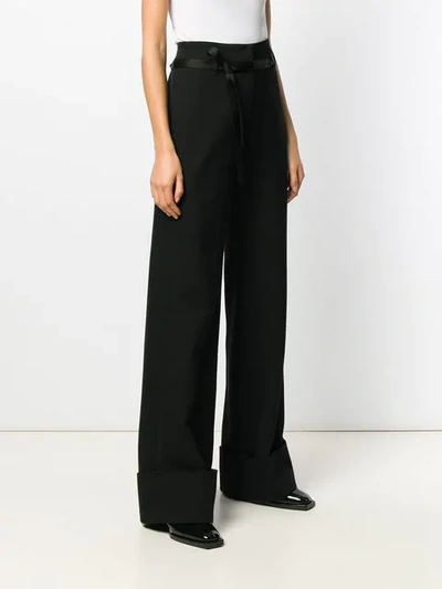 Shop Ann Demeulemeester Flared Trousers In Black