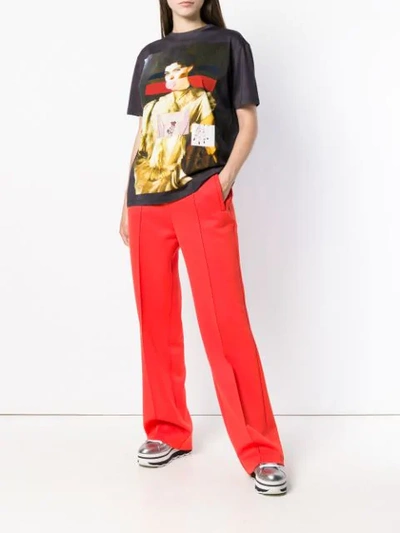 Shop Prada Logo Patch Flared Trousers In Yellow