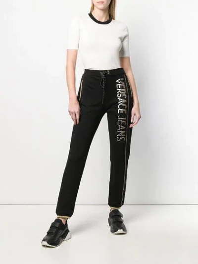 Shop Versace Jeans Studded Logo Track Pants In Black
