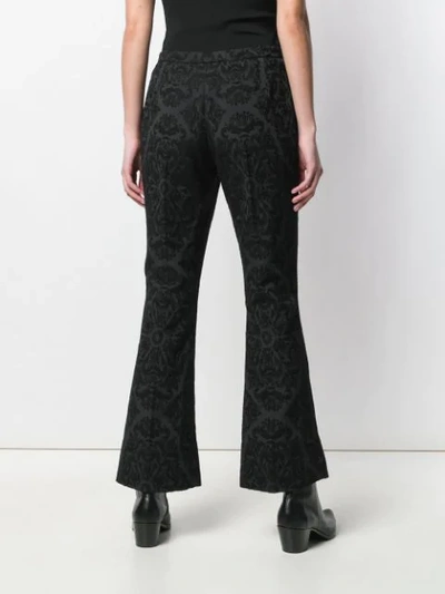 Shop Saint Laurent Jacquard Flared Trousers In Black