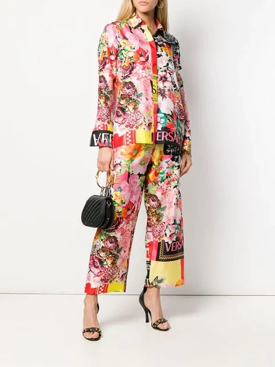 Shop Versace Floral Print Logo Trousers In Yellow