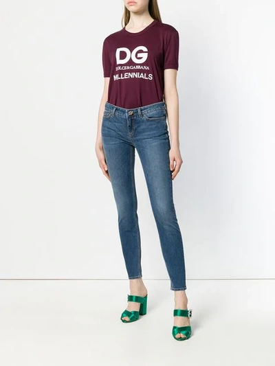 Shop Dolce & Gabbana Skinny Jeans With Floral Button In Blue