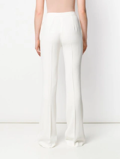 Shop Giambattista Valli Bootcut Trousers In White