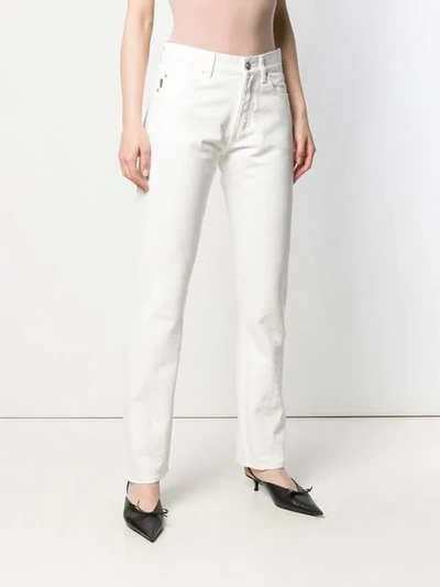 Shop Balenciaga Twisted Leg Jeans In White