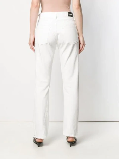 Shop Balenciaga Twisted Leg Jeans In White