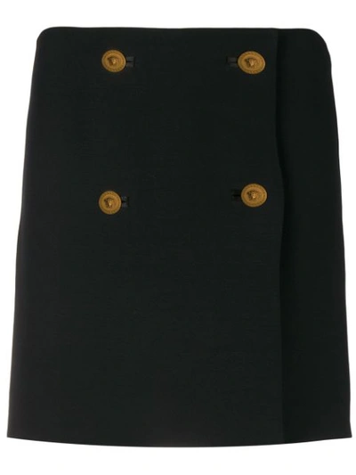 Shop Versace Button-embellished Pinafore Skirt In Black