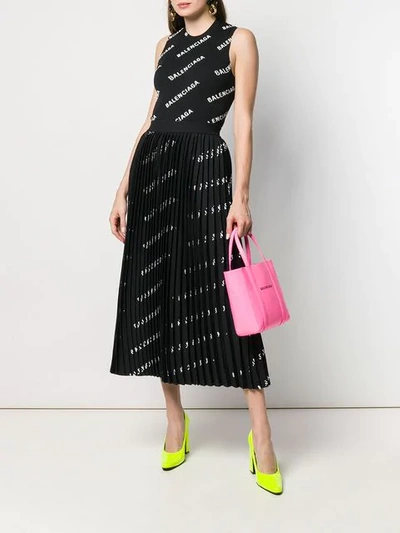 Shop Balenciaga Logo Printed Pleated Skirt In Black