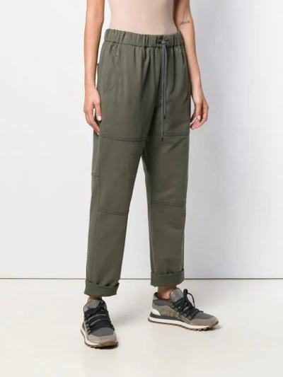 Shop Brunello Cucinelli Tapered Trousers In Green