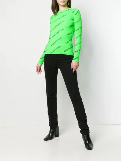 Shop Balenciaga Allover Logo Sweater In Green