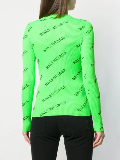 Shop Balenciaga Allover Logo Sweater In Green