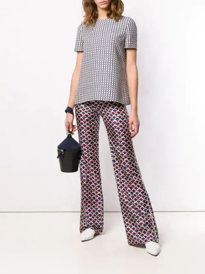 Shop Valentino Scalloped Logo Print Trousers In Blue