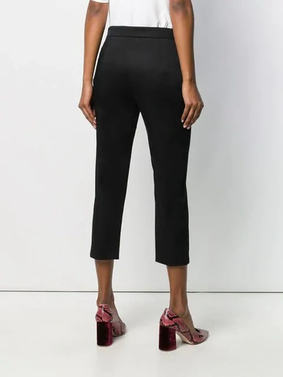 Shop Moschino Cropped Tailored Trousers In Black