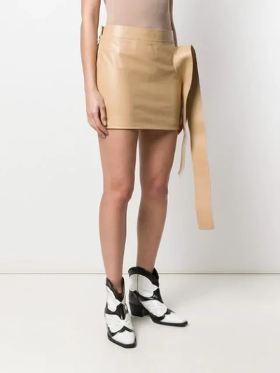 Shop Jw Anderson Toast Leather Tab Mini Skirt In Neutrals