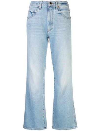 Shop Khaite Stonewashed Flared Jeans In Blue