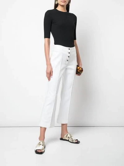 Shop Rosetta Getty Cropped Flare Jeans In White