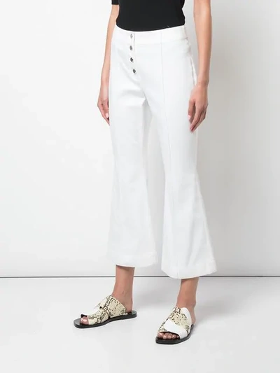 Shop Rosetta Getty Cropped Flare Jeans In White