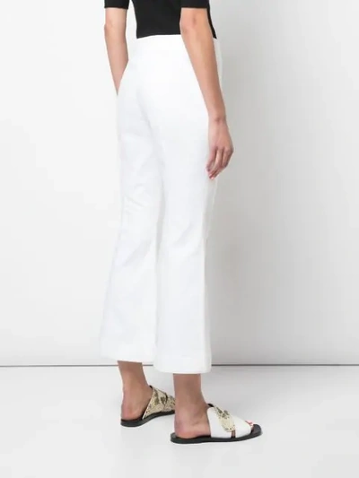 Shop Rosetta Getty Cropped Flare Jeans In White