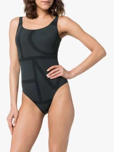 Shop Totême Positano Monogram Swimsuit In Black