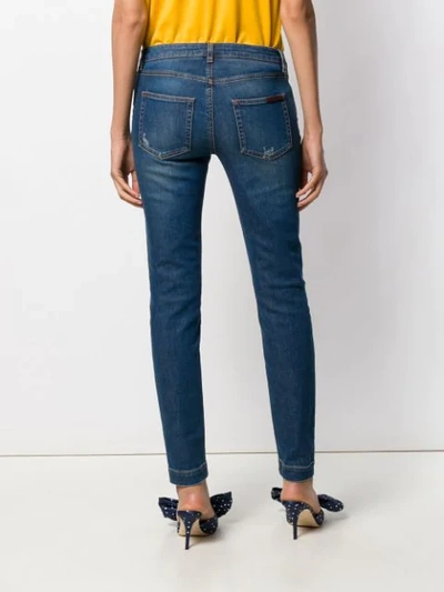 Shop Dolce & Gabbana Floral Appliqué Skinny Jeans In Blue