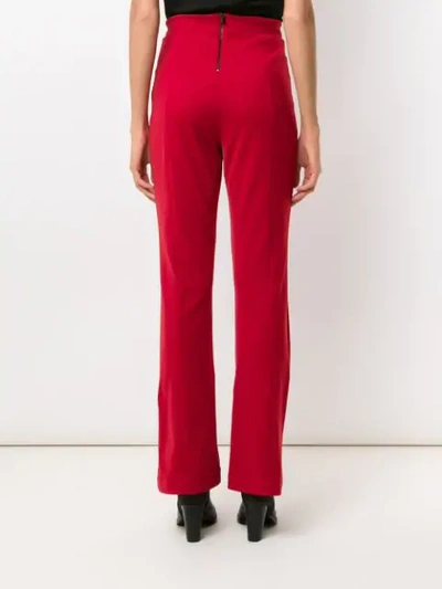 Shop Osklen Flared Pants In Red