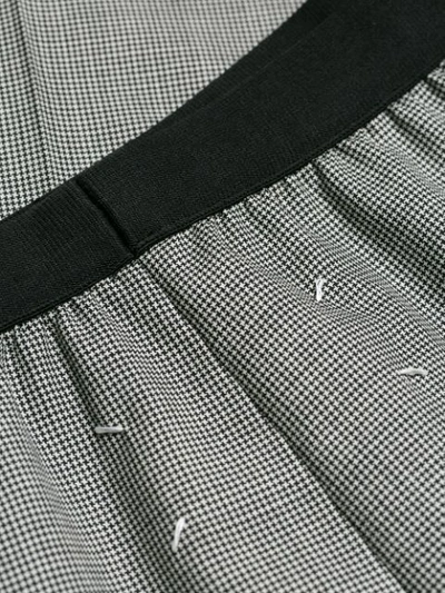 Shop Maison Margiela Micro Houndstooth Check Trousers In Black