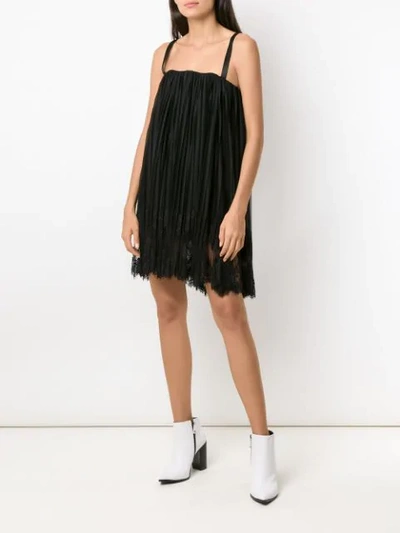 Shop À La Garçonne Pleated Mini Dress In Black