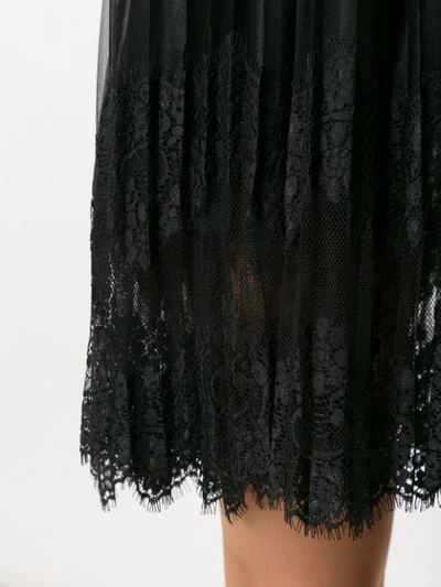 Shop À La Garçonne Pleated Mini Dress In Black