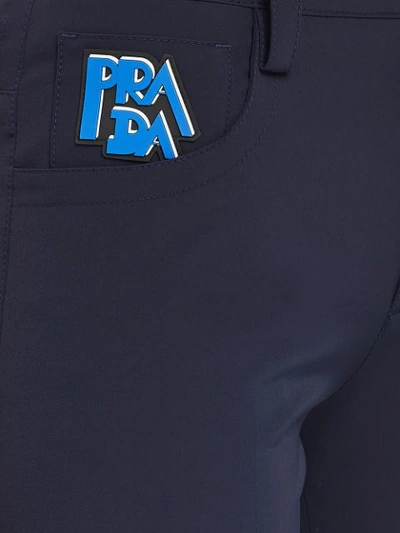Shop Prada Stretch Technical Fabric Trousers In Blue