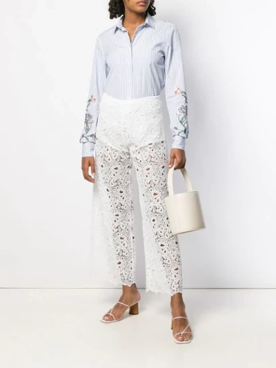 Shop Ermanno Scervino Floral Lace Cropped Trousers In White